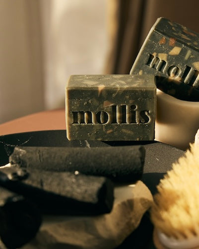 Luxurious black soap with activated charcoal and warm oudh fragrance