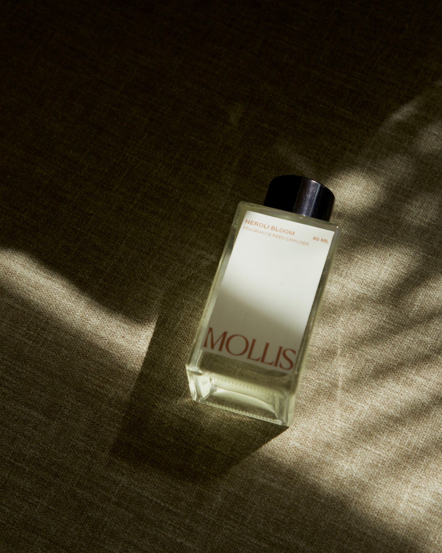 Mollis handmade reed diffusers India — natural home fragrance in Amber Ash, Santal Noir, Neroli Bloom and Fresh Linen